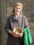 Eastern european senior farmer woman holding eggs