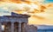 Eastern facade of Propylaea entrance gateway overlooking the city of Athens at sunset