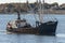 Eastern rig commercial fishing boat Discovery crossing New Bedford outer harbor