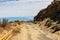 Eastern Washington Palouse vast expanse desert view rocky cliff dry grass and abandoned road