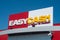 Easy cash logo on store front on blue sky background - Easy cash is the leader of the sell used chain in France