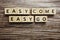 Easy Come  Easy Go alphabet letters on wooden background