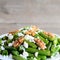 Easy green bean salad with cottage cheese and peeled walnuts. Tasty green beans recipe. Closeup