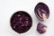 Easy homecooked coleslaw from red cabbage in a bowl and ingredients on white table background. Top view, copy space.