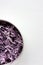 Easy homecooked creamy coleslaw from red cabbage in a bowl on white table background. Top view, copy space. Fresh vegetable salad