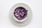 Easy homecooked creamy coleslaw from red cabbage in a bowl on white table background. Top view, copy space. Fresh vegetable salad