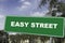 Easy street sign which shows that this street is comfortable life style for retirement or success