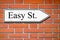 Easy street signpost wall bricks