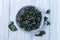 Easy three ingredient baked green kale chips with sea salt and olive oil, in gray bowl, horizontal, top view