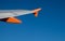 EasyJet company logo on aircraft winglet on blue sky background