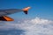 EasyJet company logo on aircraft winglet on blue sky and clouds