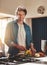 Eat healthy, feel healthy. Portrait of a happy bachelor chopping vegetables in his kitchen.