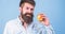 Eat healthy. Man with beard hipster hold apple fruit hand. Nutrition facts and health benefits. Apples popular fruit in