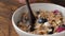 Eating breakfast cereals Granola with berries