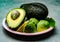 Eating of fresh ripe green organic hass avocado