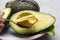 Eating of fresh ripe green organic hass avocado fruit with spoon