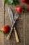 Eating fresh strawberries, vintage cuttlery fork and knife. Healthy diet and slim figure, breakfast or healthy snack. Detox and