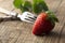 Eating fresh strawberries, vintage cuttlery fork and knife. Healthy diet and slim figure, breakfast or healthy snack. Detox and