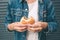 Eating hamburger. Delicious hamburger in the hands. Fastfood meal.