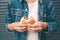 Eating hamburger. Delicious hamburger in the hands. Fastfood meal.