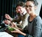 Eating healthy in the workplace. Portrait of a young office worker eating lunch with coworkers at a boardroom table.