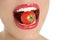 Eating a red tomato macro of woman mouth