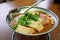 Eating stinky tofu hot pot with spicy soup