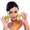 Eating well- her secret to gorgeous skin. Cropped portrait of a beautiful young woman holding kiwis.