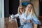 Eautiful blonde with glasses and her elderly mother are sitting in a cafe and drinking coffee. Mothers Day. Beautiful