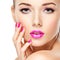 Eautiful woman face with pink makeup of eyes and nails.