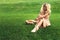 Eauty blonde alone young woman resting in the park