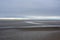 Ebb tide reveals mudflats and tidal channels at Hanagae beach, Muuido island, Incheon, South Korea