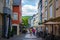 Echternach, Luxembourg; 08/11/2018: Narrow street in old town of Echternach, in Luxembourg, Europe. Typical houses with flags and