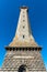 Eckmuhl Lighthouse in Brittany against blue sky