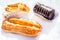 Eclair or palo, Swiss roll or brazo de gitano and cream pastry or pastel de crema
