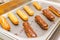 Eclairs on a baking sheet. Selective focus.