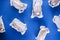 Eclairs on a blue background flat lay, close-up. French dessert