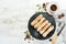 Eclairs with cream. Baking. Top view