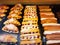 Eclairs and croissants with whipped cream and raspberries