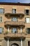 Eclectic facade of a residential building. Brick brick building with curvilinear terraces and decorations