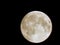 Eclipse of the moon in the night sky with a hoop of light around a close-up