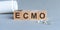 ECMO is a word written in black letters on wooden cubes