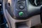 Eco button in a hybrid car, switching vehicle to eco mode to save the environment, electric car