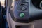 Eco button in a hybrid car, switching vehicle to eco mode to save the environment, electric car