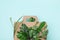 Eco cardboard box from recyclable organic materials with green leaves. Eco friendly cardbox packaging, zero waste and plastic free