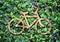 Eco concept :Wood texture Bicycle icon on green leaves wall