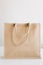 eco fabric bag beige handles white background