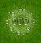 Eco friendly background with water drops on fresh green grass te