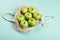 Eco-friendly beige shopping bag with grapes on a white background. String bag with fruits. Zero waste, no plastic concept