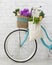 Eco friendly bicycle decorated by wildflowers and shopping bag